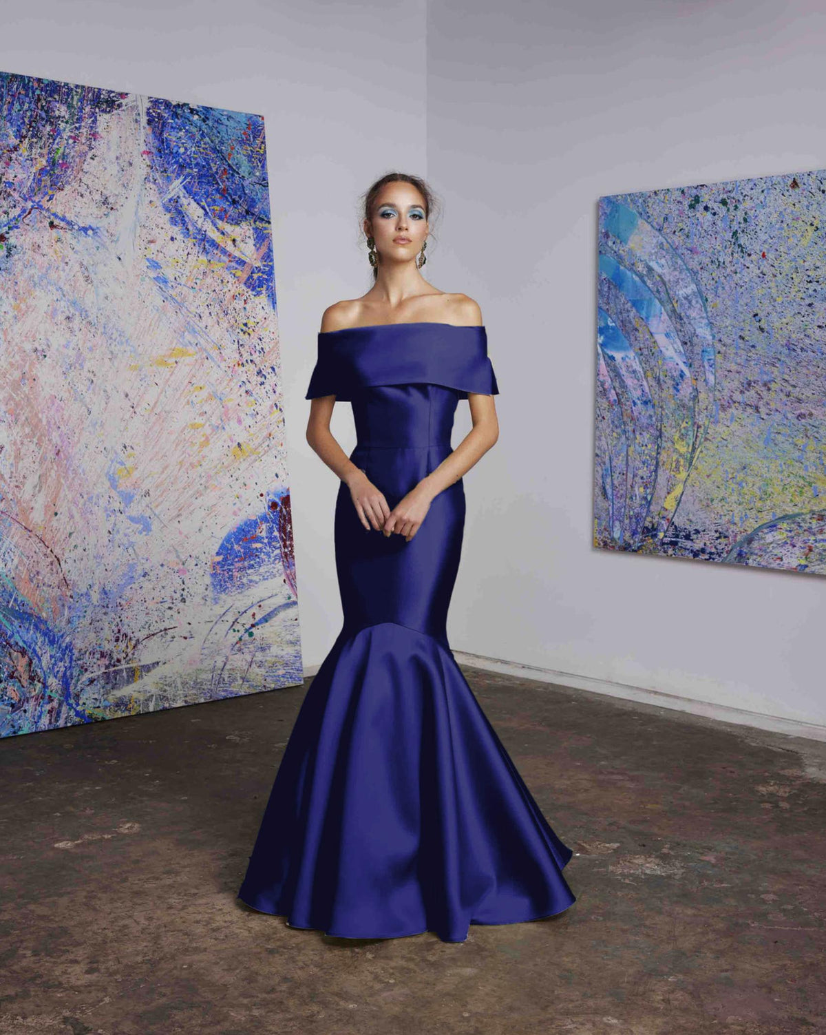 Royal blue satin off-the-shoulder mermaid gown with a wide collar band and floor-length skirt for formal events.