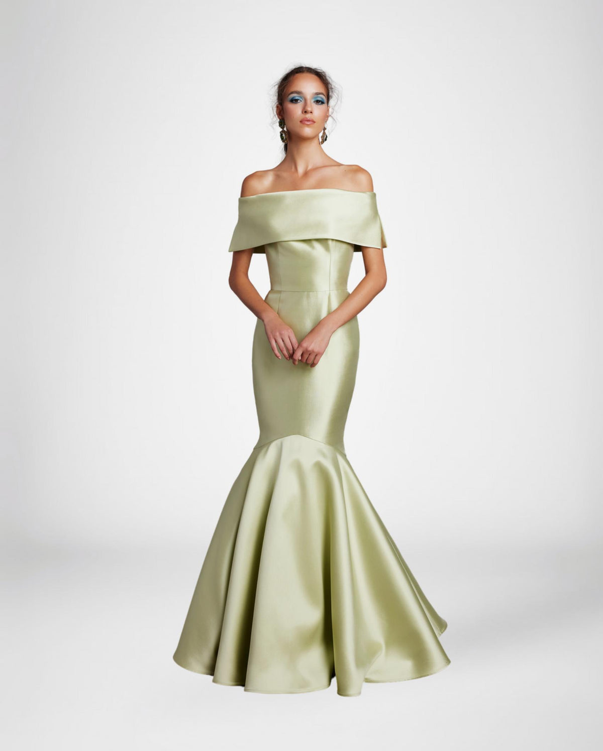 Sage green satin off-the-shoulder mermaid gown with a wide collar band and floor-length flared skirt.