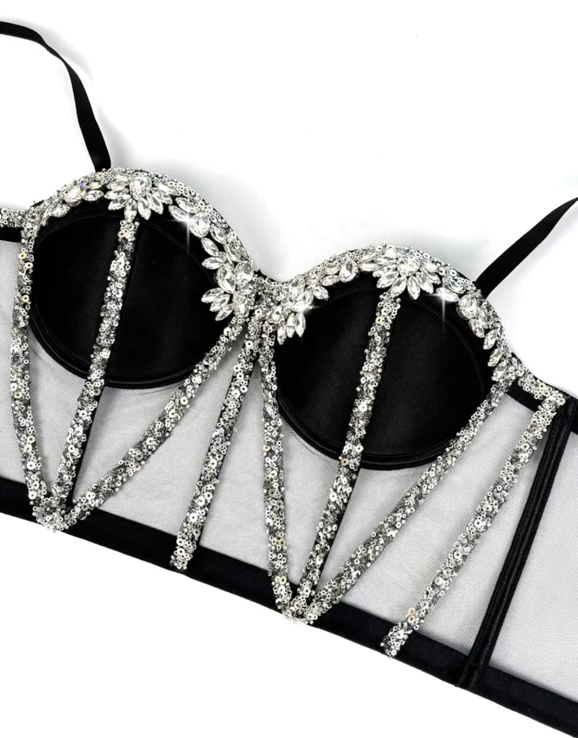 Black mesh Rocky bustier with structured boning, silver sequin trim, and sparkling rhinestone embellishments.