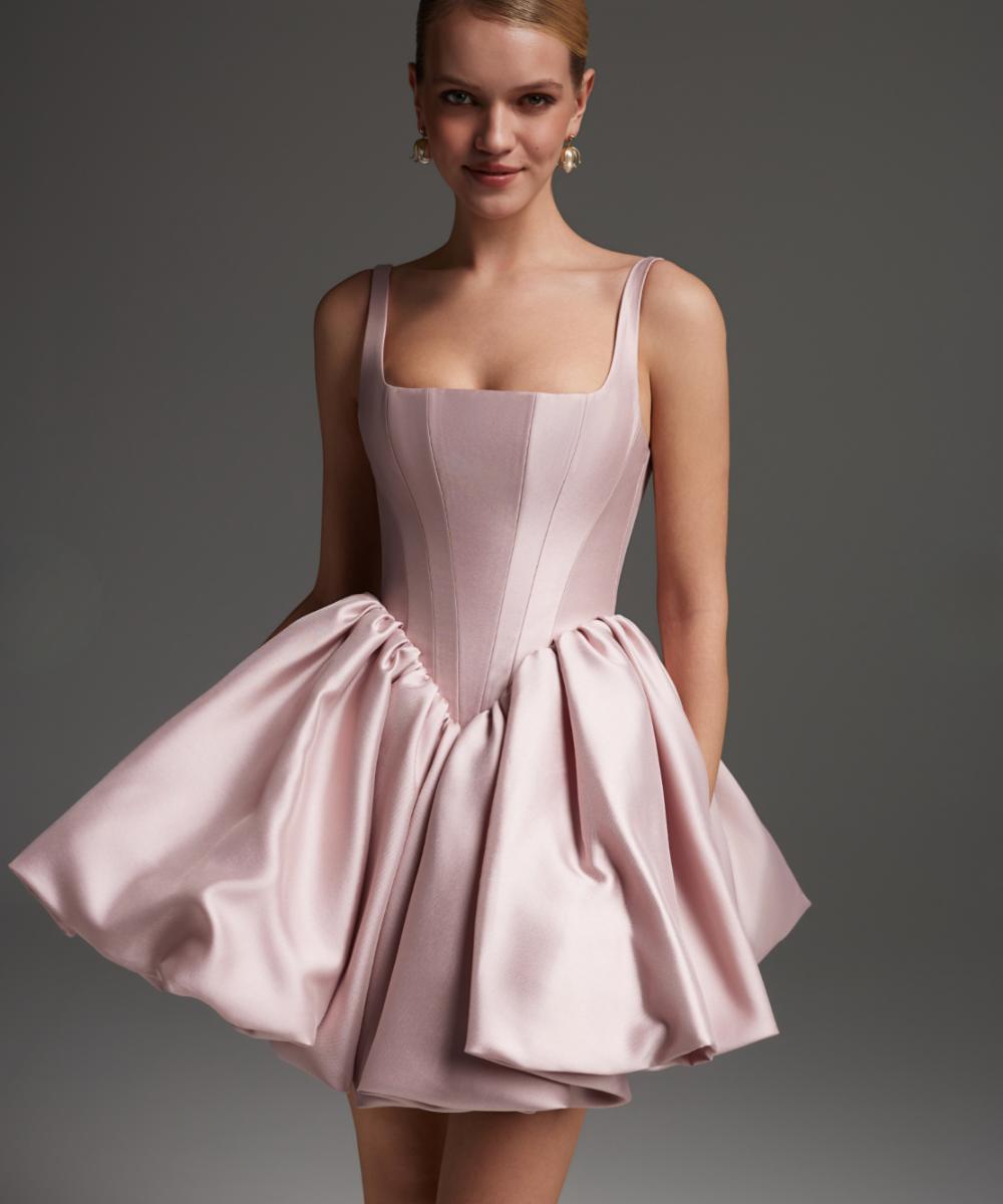 Pink satin mini dress with a square neckline, structured corset bodice, and a voluminous bubble skirt.