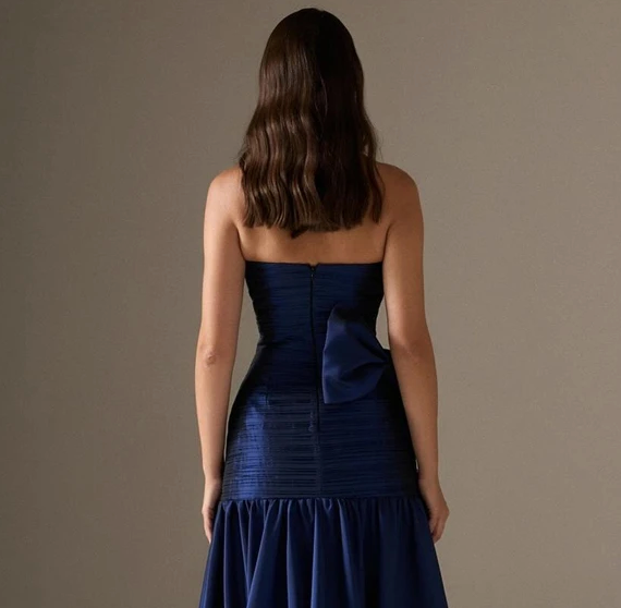 Woman wearing The Old Money Collection Couture Candelaria Gown