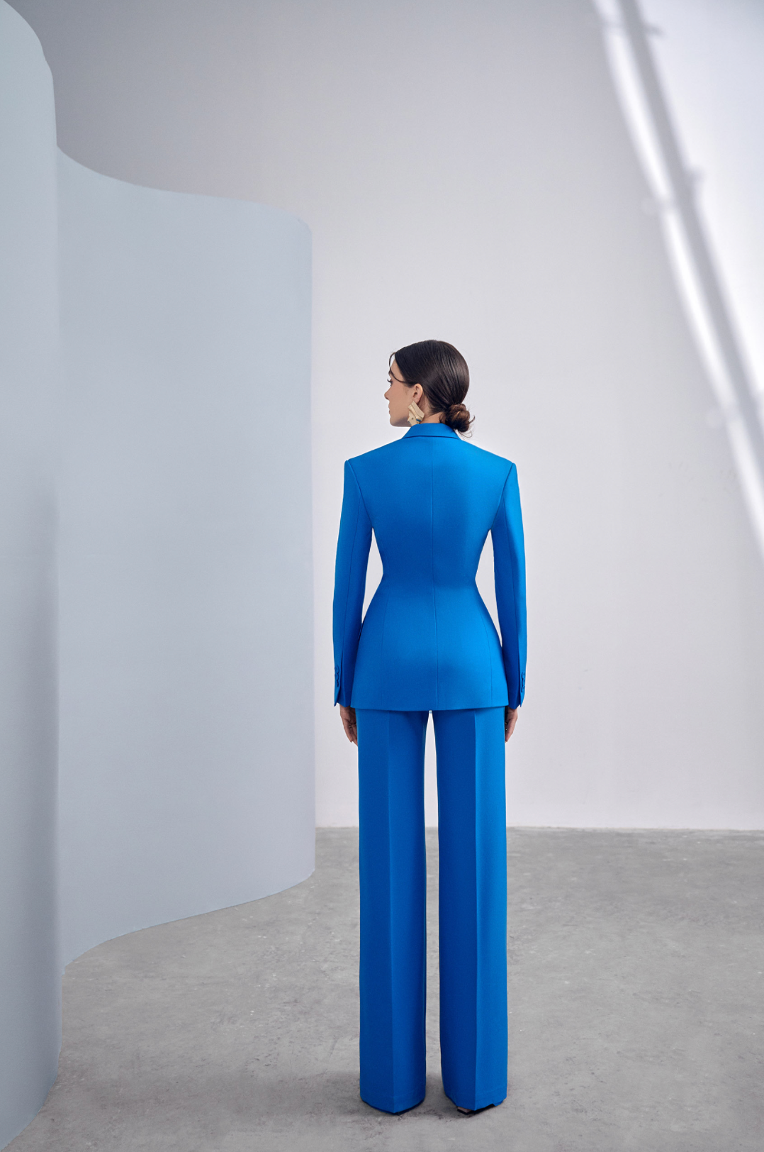 Woman wearing the Old Money Collection Couture Bowery Business Suit