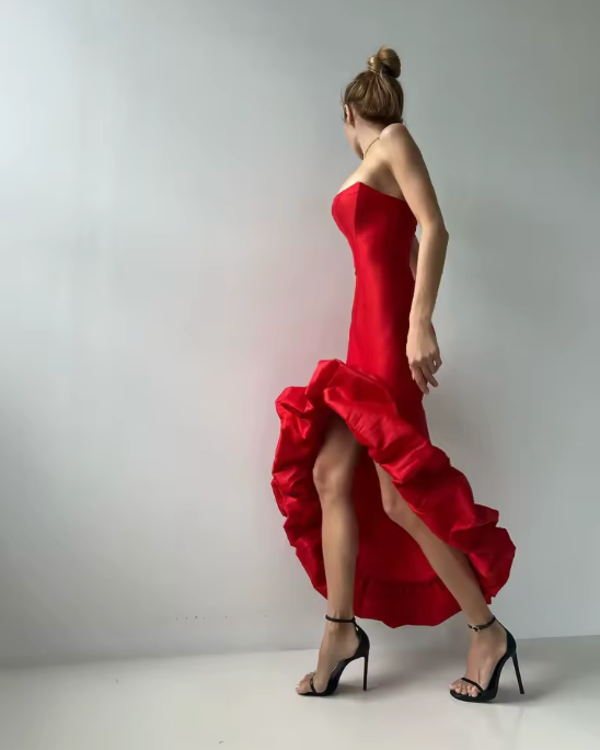 Woman wearing the Old Money Collection Couture red Herne Bay Cocktail Dress