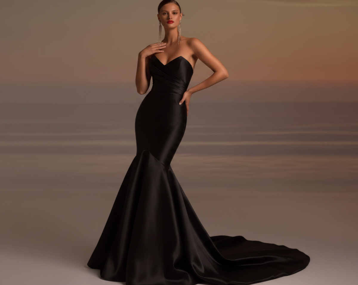 Elegant black satin fishtail gown with a strapless sweetheart neckline and pleated bodice for formal events.