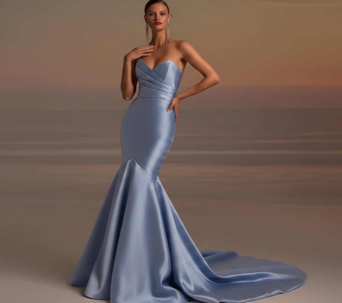 Model wearing a light blue satin fishtail gown with a strapless pleated bodice and elegant floor-length train.