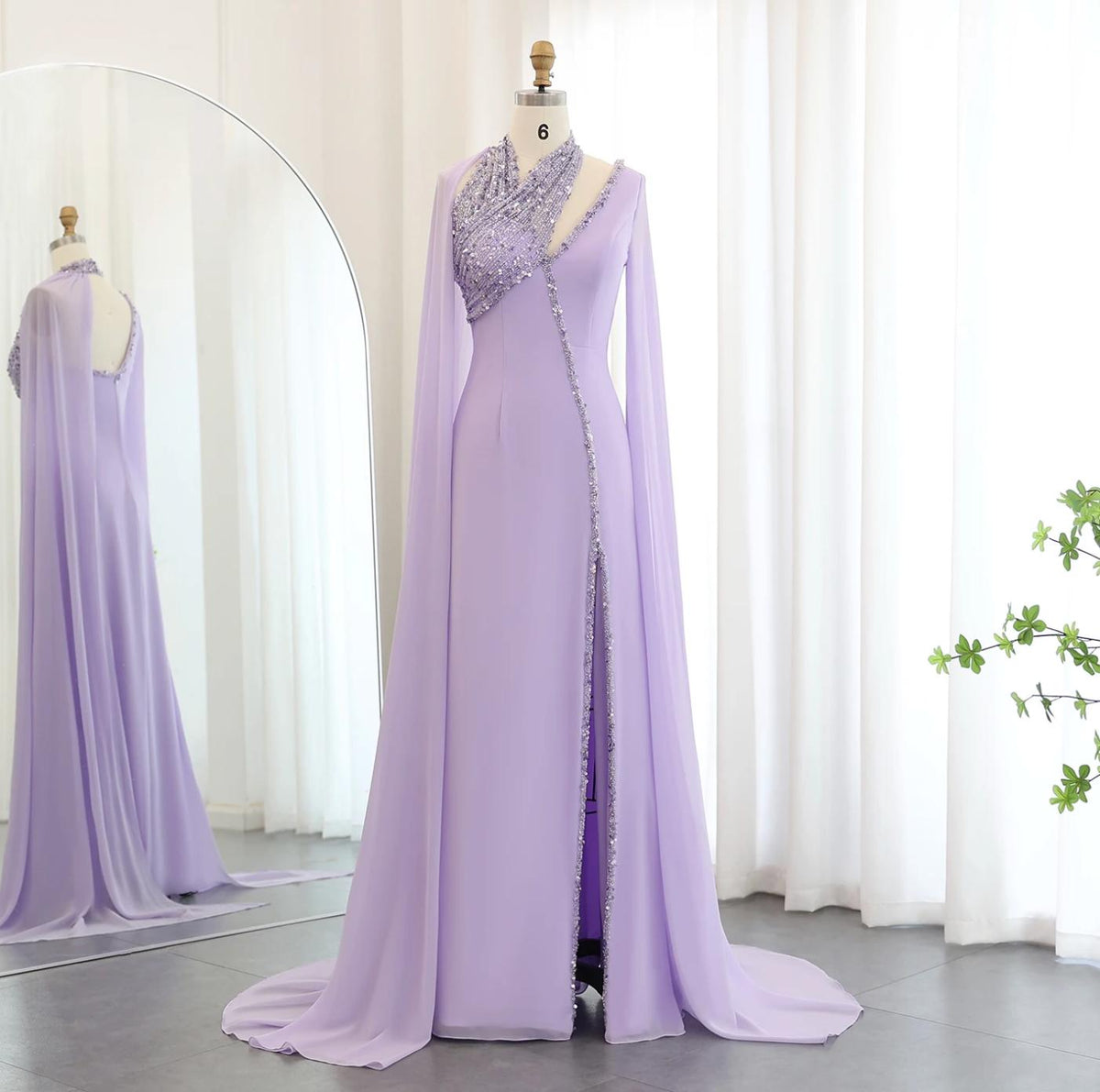 Lavender chiffon Selma gown with beaded halter neckline, cape sleeves, and a floor-length train on a mannequin.