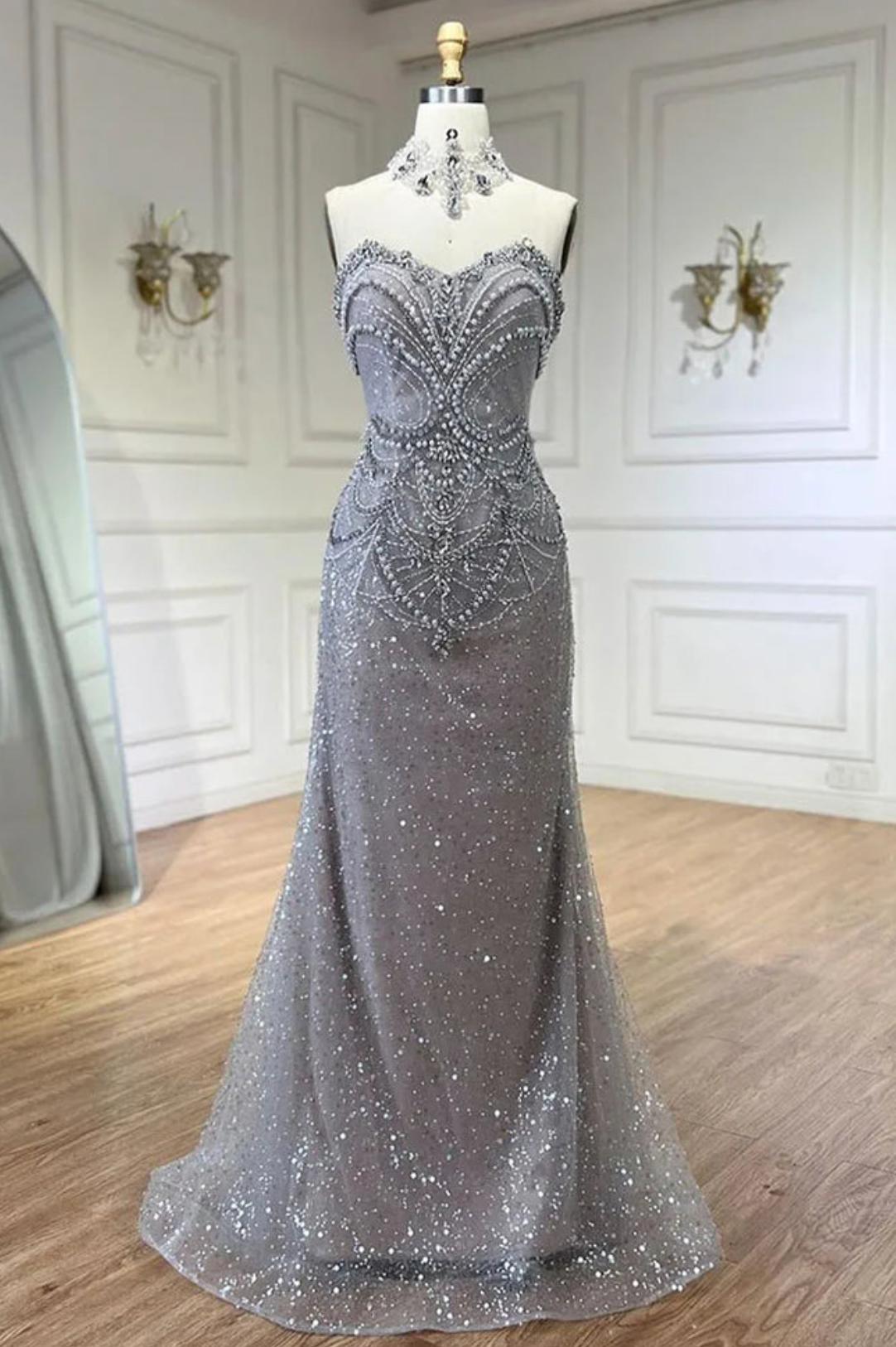 Strapless grey mermaid gown featuring intricate crystal beadwork, pearl embellishments, and a shimmering tulle overlay.