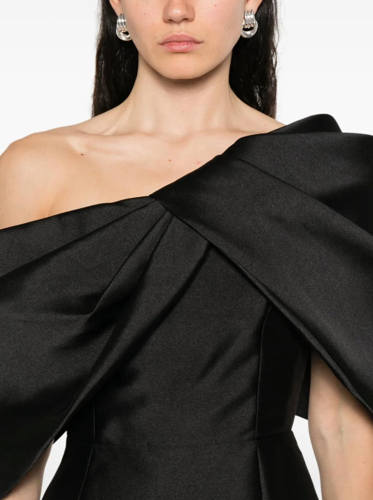 Black twill satin one-shoulder gown featuring an architectural asymmetric neckline and elegant draped fabric.