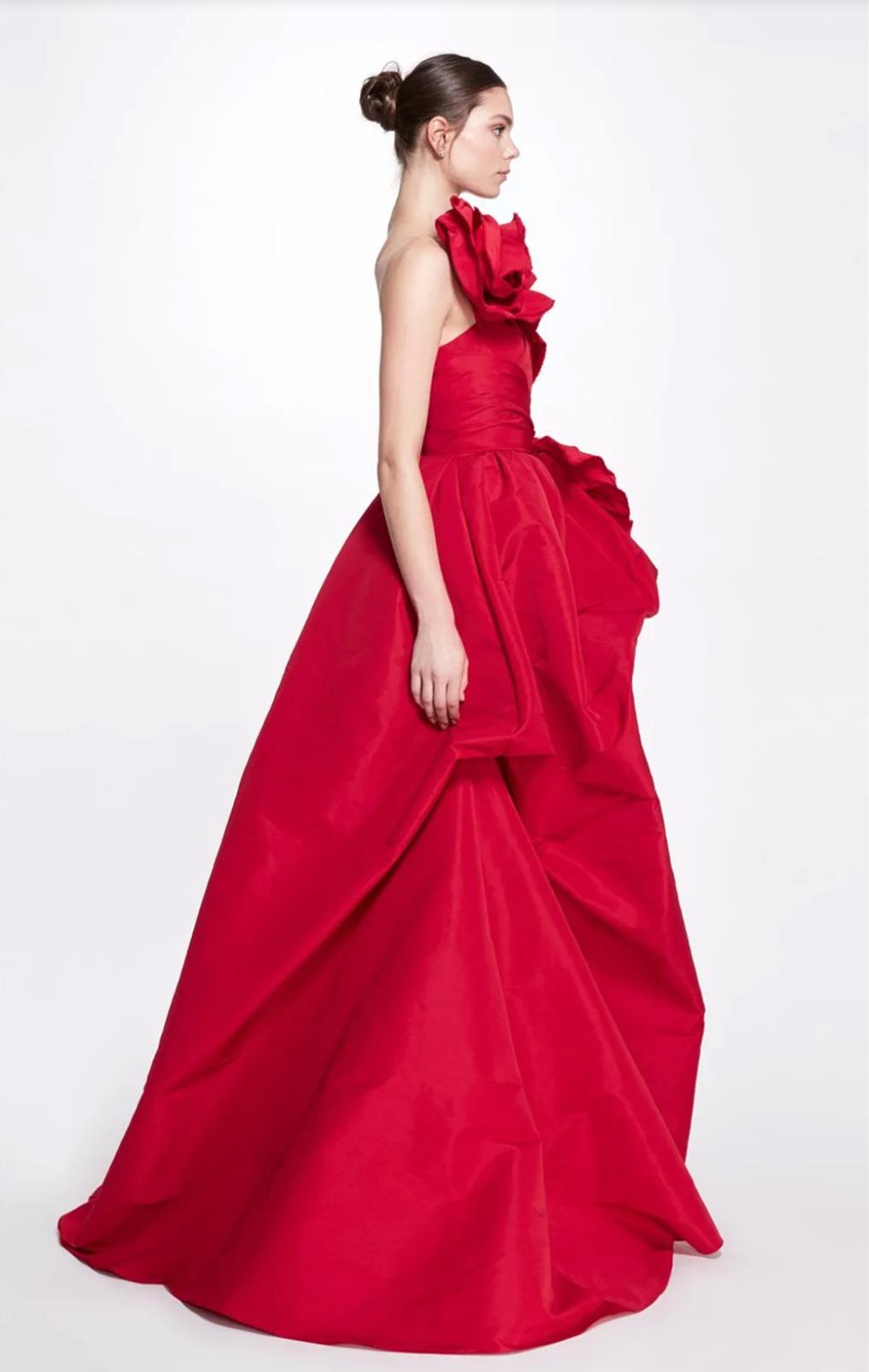 Red one-shoulder A-line gown in satin with dramatic 3D floral accents and a floor-length chapel train.