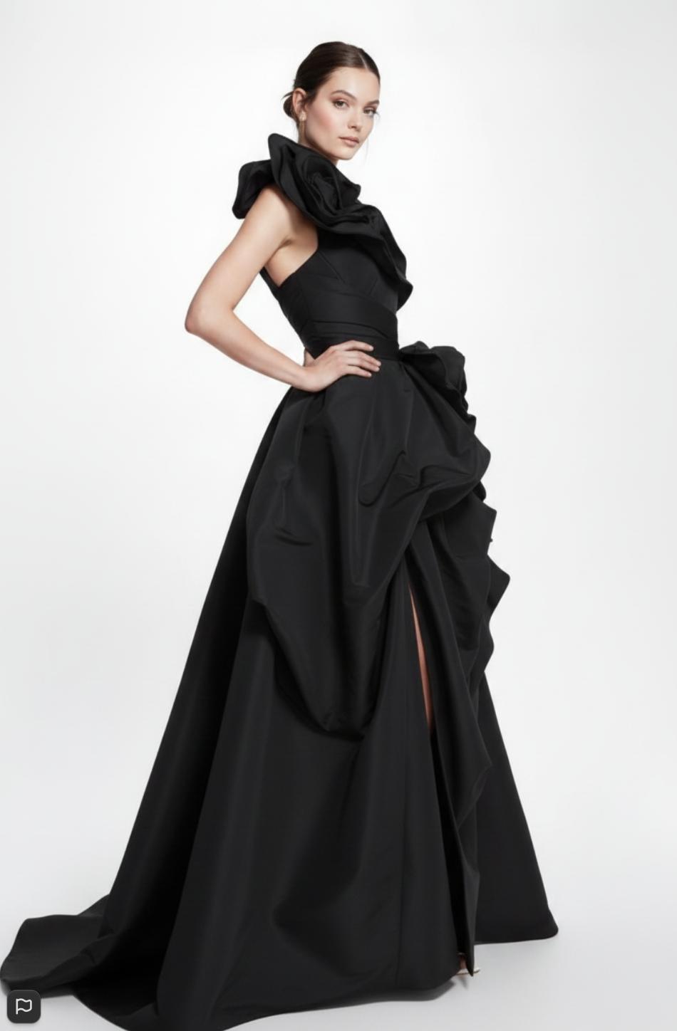 Black one-shoulder taffeta A-line gown featuring dramatic 3D oversized floral embellishments and a floor-length train.