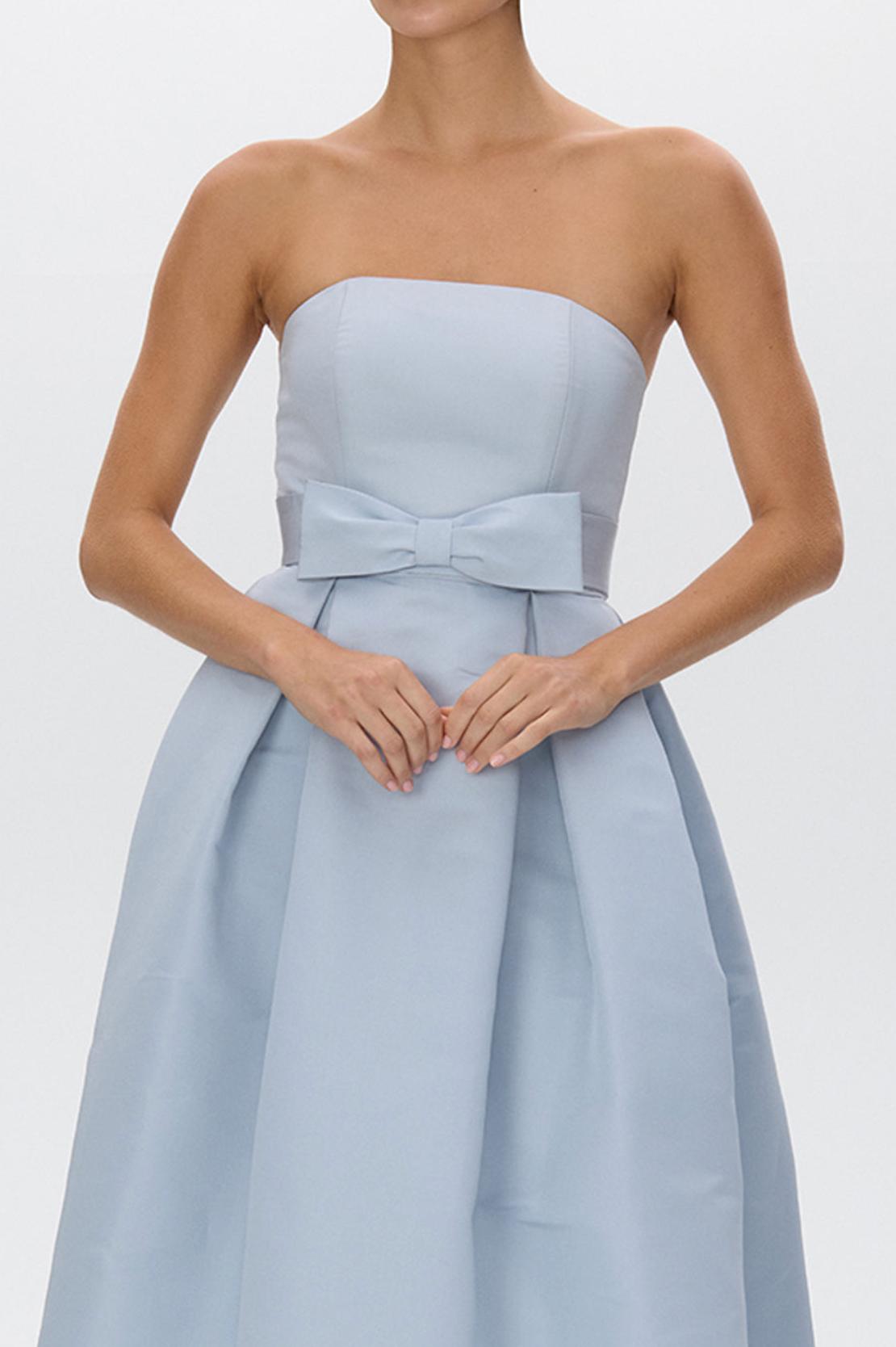 Strapless light blue satin gown with a pleated full-length skirt and a removable bow belt at the natural waist.