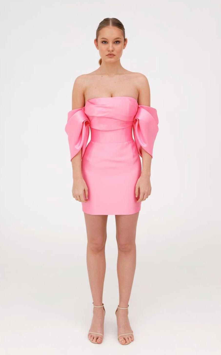 Pink strapless Mikado mini dress with a structured corset bodice and elegant draped bow sleeves.