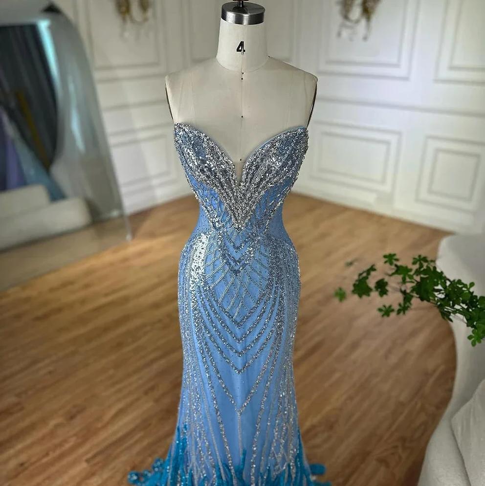 Strapless blue mermaid gown featuring intricate silver sequin beadwork and delicate tulle on a size 4 mannequin.
