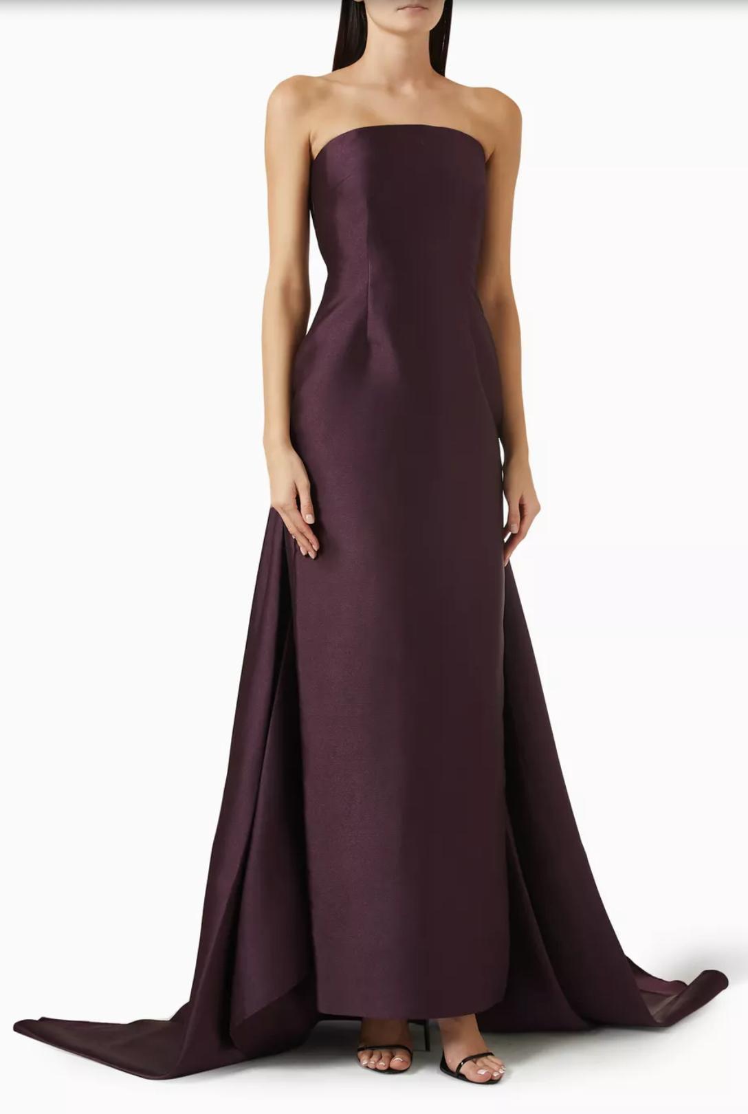 Strapless dark purple twill evening gown with a floor-sweeping detachable train and sleek, minimalist silhouette.