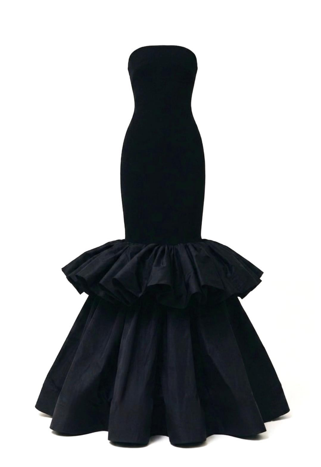 Elegant black strapless evening gown with a fitted jersey bodice and a dramatic double-ruffle taffeta mermaid skirt.