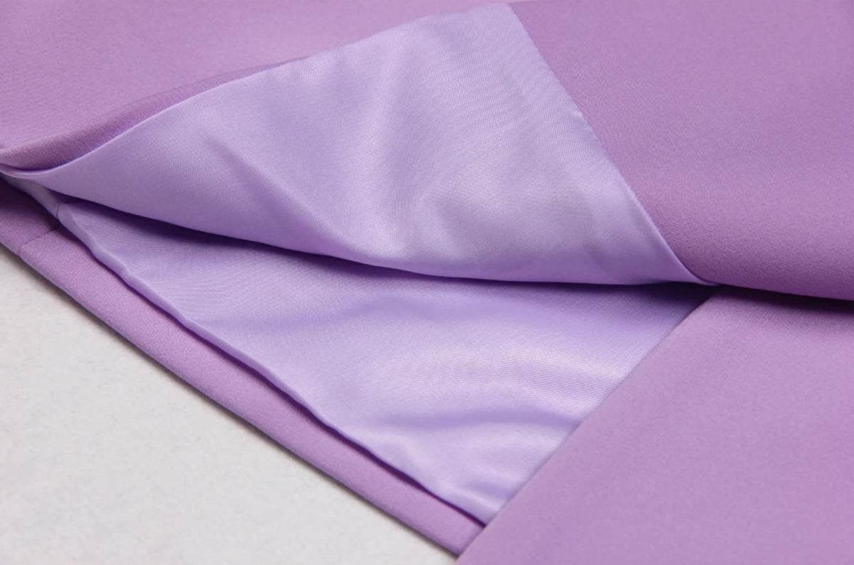 Close-up of The Mulia two-piece suit in lavender Italian satin, showing the smooth, fully lined interior fabric.