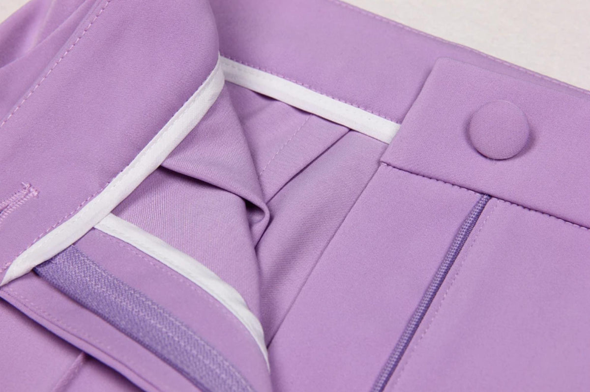 Lavender Italian satin suit trousers featuring a fabric-covered button, zipper fly, and clean white interior lining.