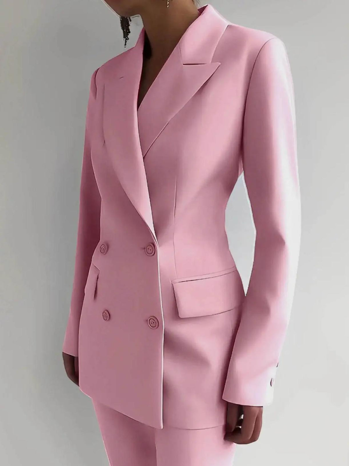 Tailored pink Italian satin double-breasted suit jacket with sharp lapels and structured silhouette.