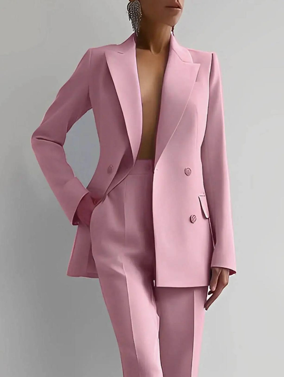 Tailored pink two-piece suit in Italian satin featuring a structured double-breasted blazer and matching trousers.