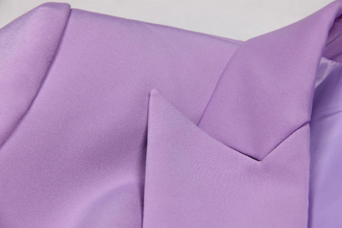Close-up of a lavender Italian satin double-breasted blazer featuring sharp lapels and a smooth, tailored finish.