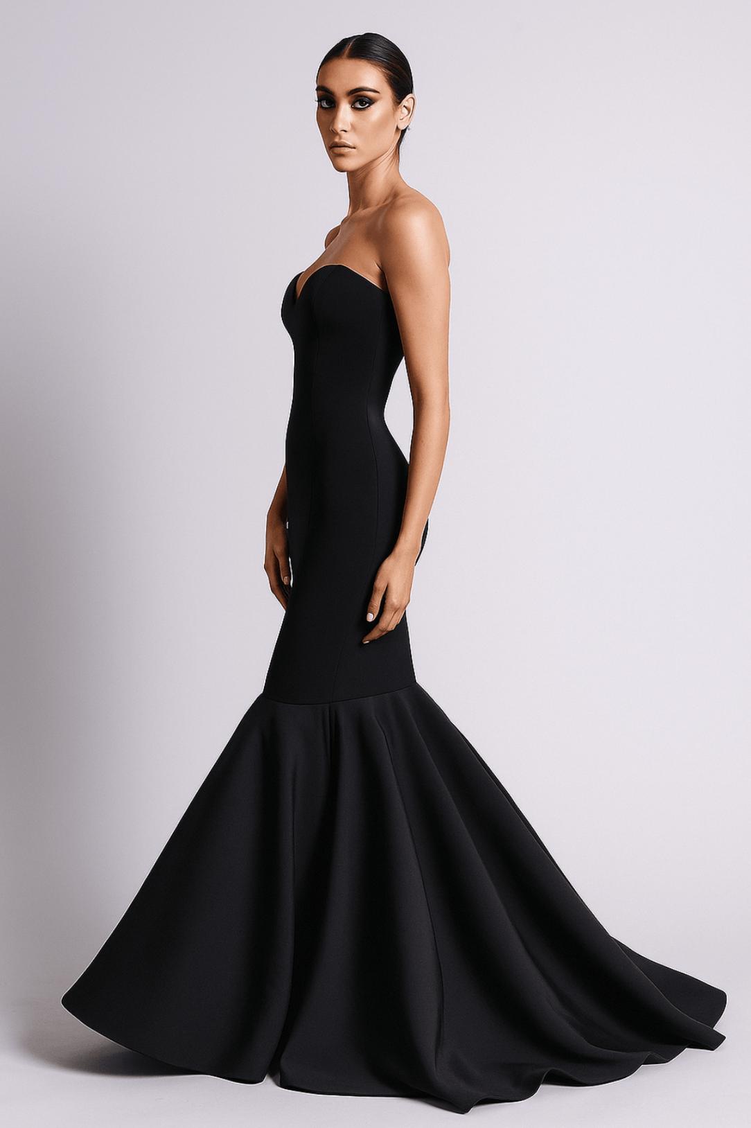 Elegant black mermaid gown with a sweetheart neckline and a dramatic sweep train in luxurious satin.