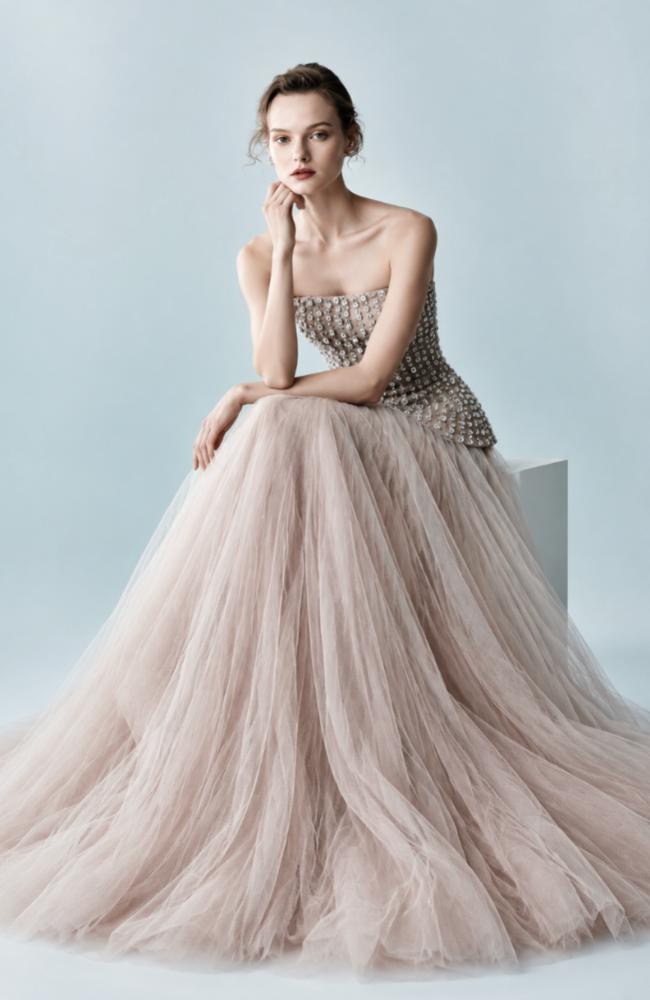 Strapless Putu Gede gown featuring a crystal-embellished corseted bodice and a voluminous, layered tulle skirt.