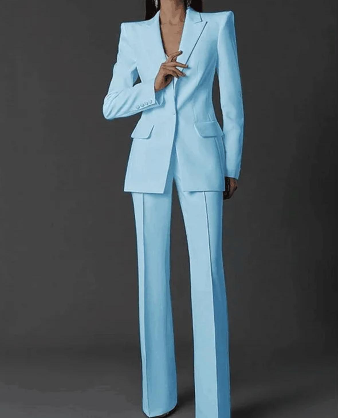 Light blue Via Condotti suit set featuring a sharp single-breasted blazer and tailored trousers in smooth Italian satin.