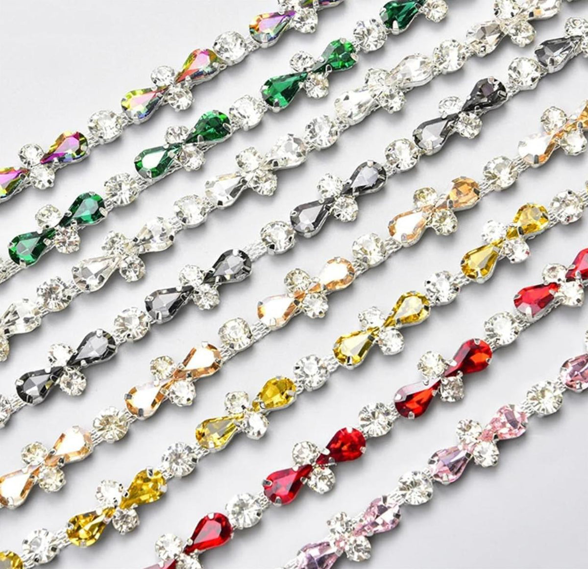 Rows of sparkling multi-colored crystal and beaded trim embellishments for formal evening gowns.