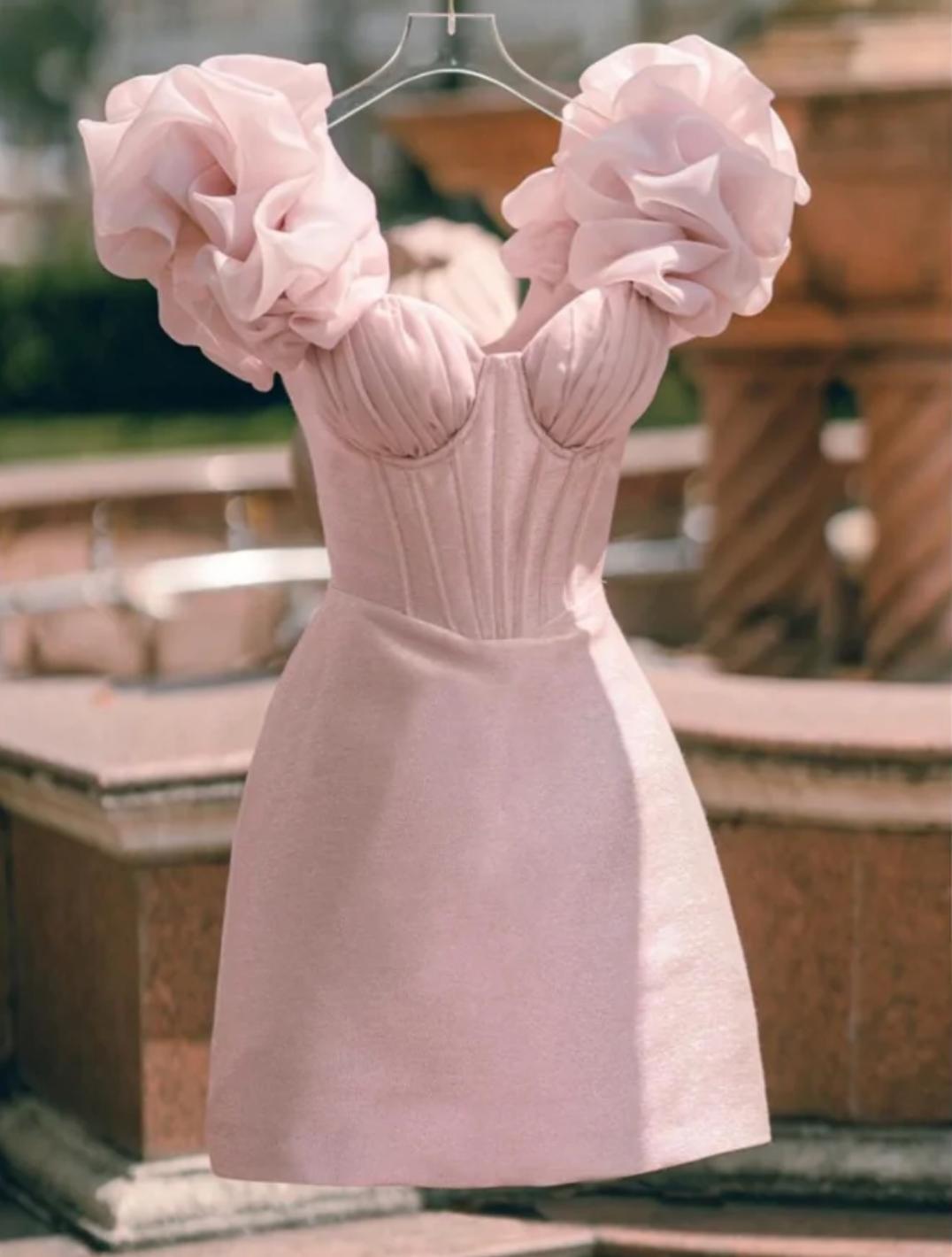 Blush pink satin mini dress with a sweetheart corset bodice and dramatic 3D floral tulle puff sleeves.