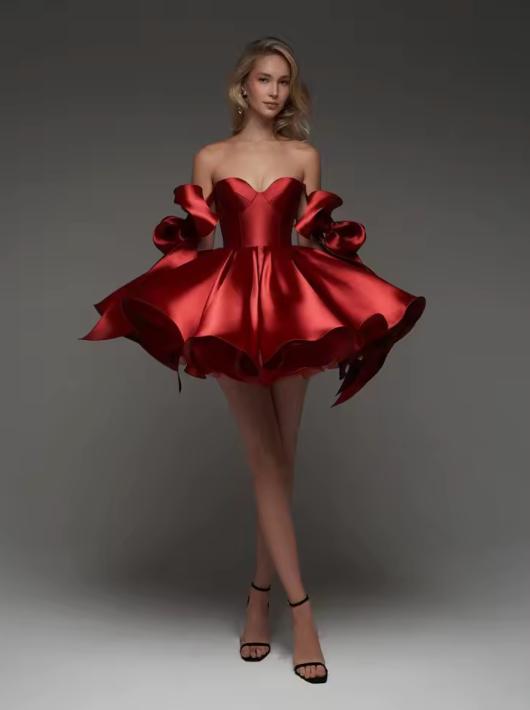 Red satin mini ball gown with sweetheart neckline, empire waist, and voluminous bow-accented sleeves.