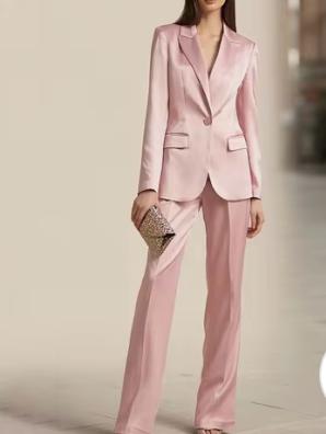Slim-fit pink satin two-piece office suit with a single-button blazer, peak lapels, and matching full-length trousers.